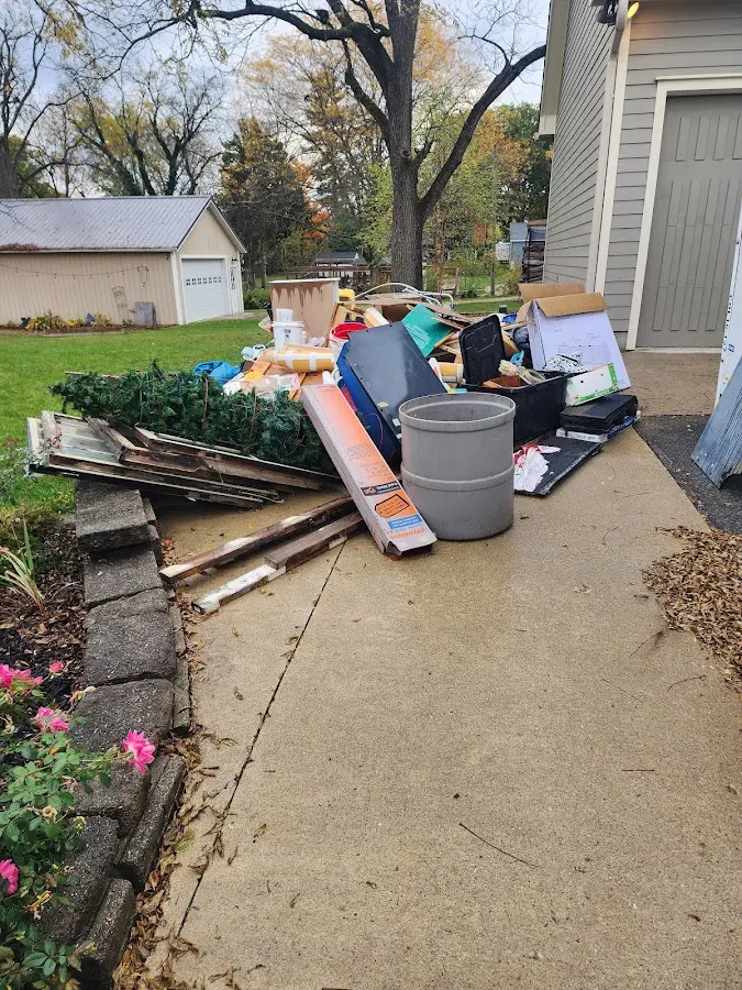 Dumpster being loaded with debris for Demolition Dumpster Rental in Signal Mountain